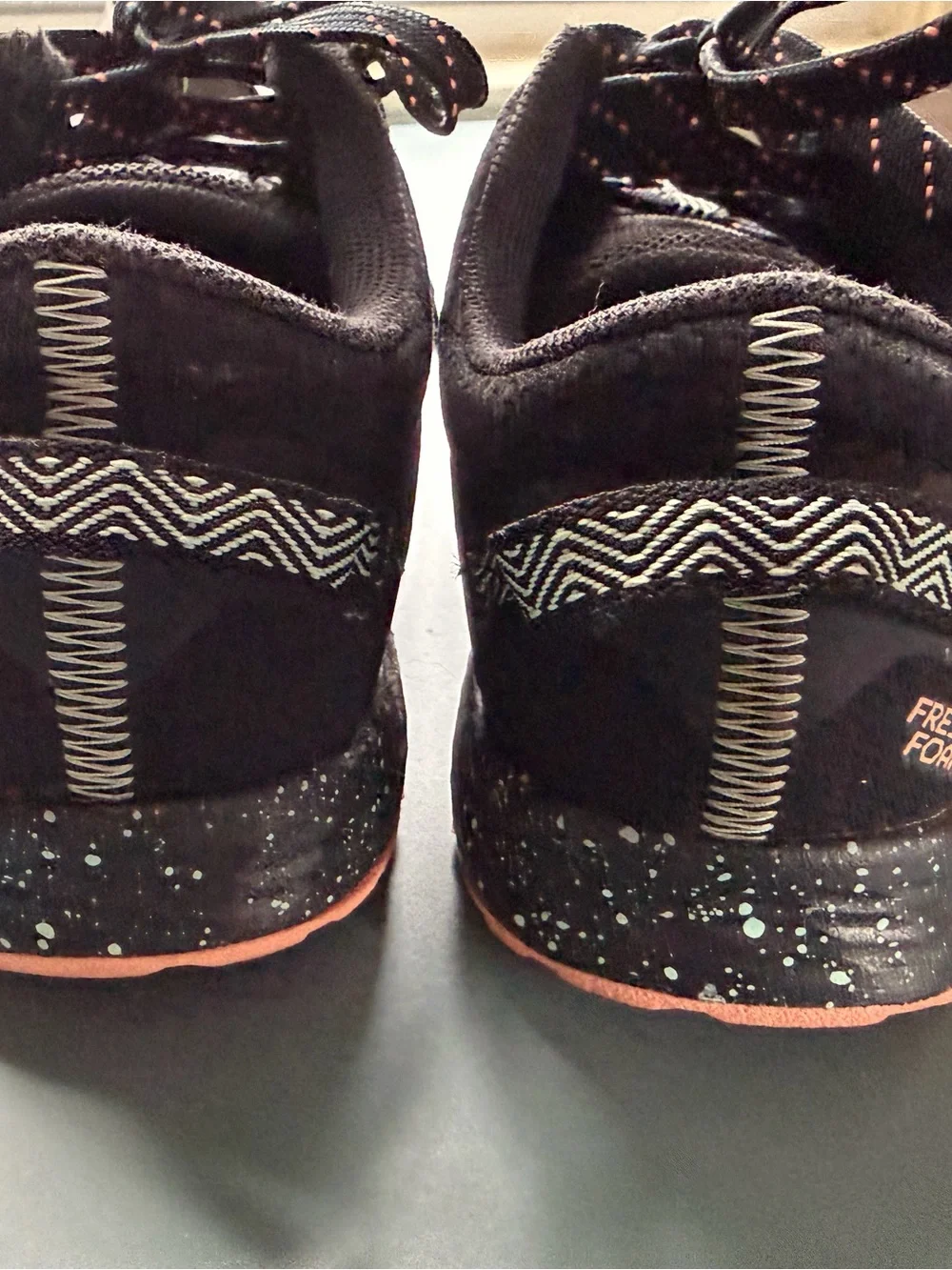 New Balance Kids Black Sneakers with orange/teal Accent
